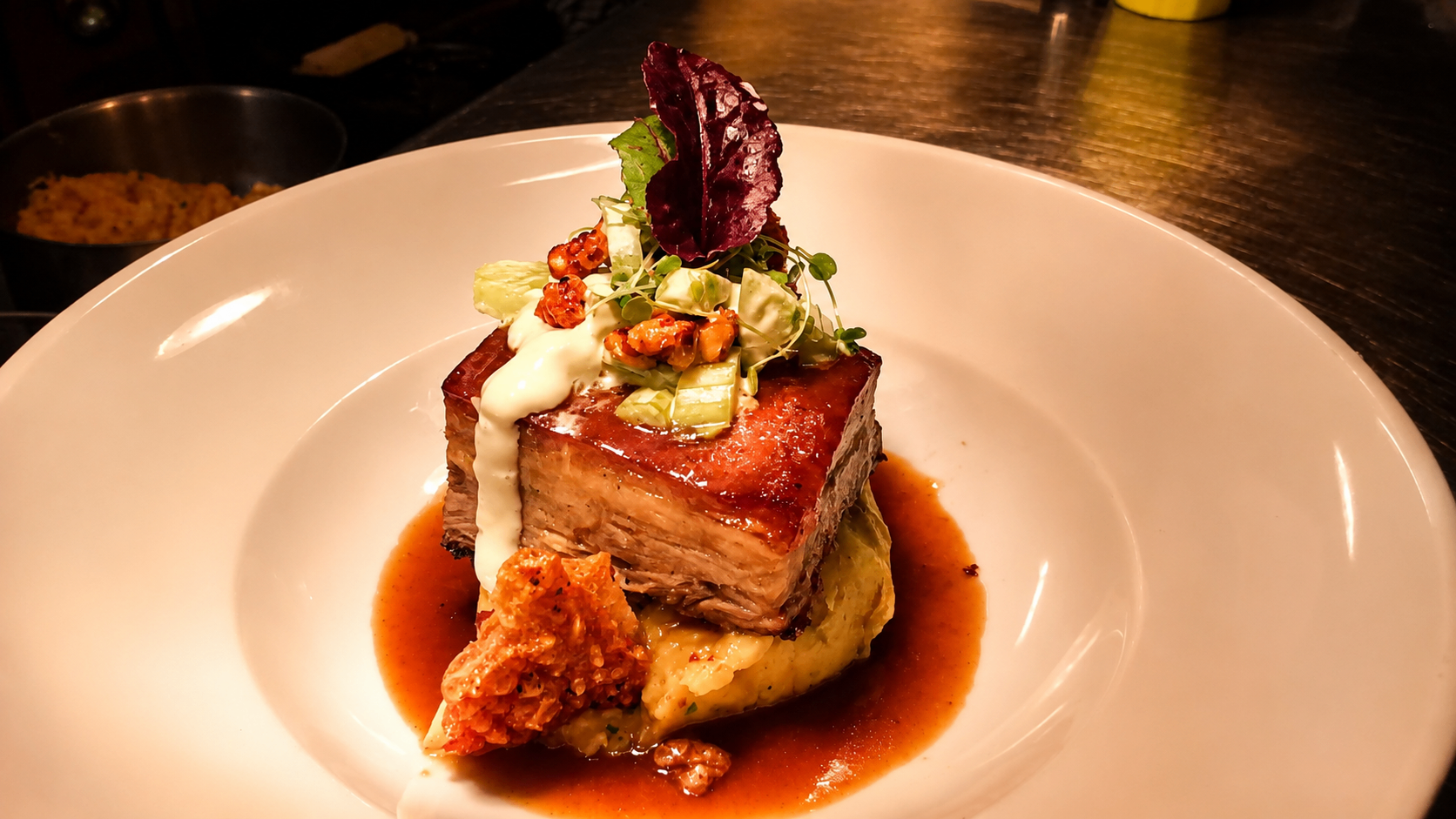 PORK BELLY · ROASTED GARLIC MASH . WALDORF SALAD. JUS