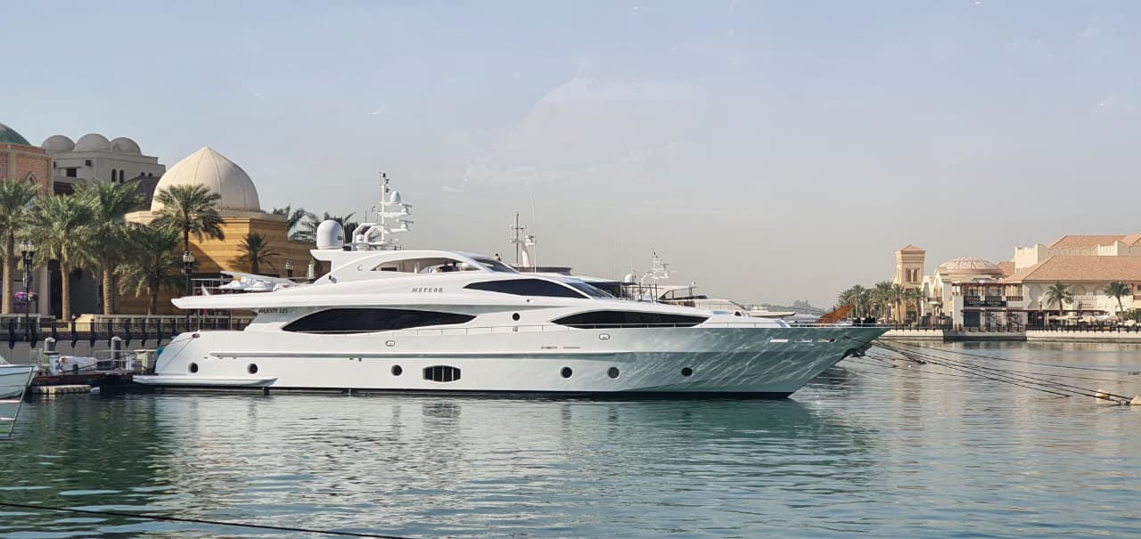 Zikrit white motor yacht docked at The Pearl